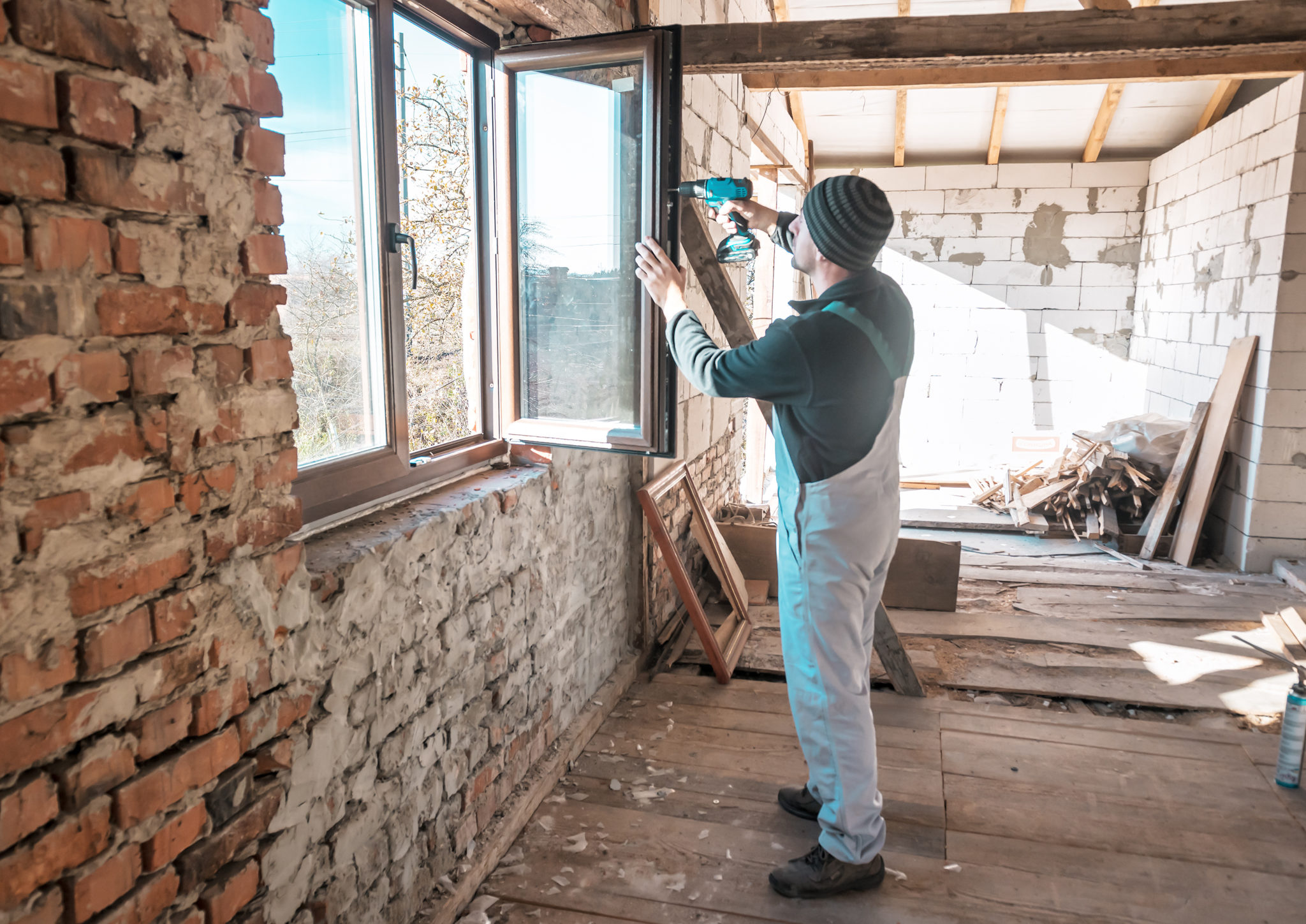 Contractor installing windows