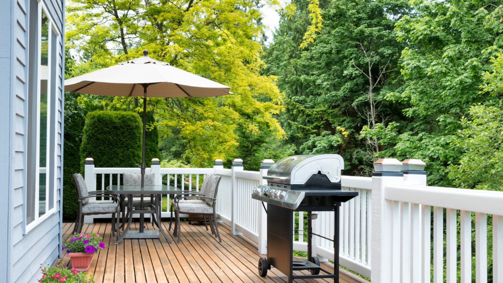 Wood deck with a grill and table