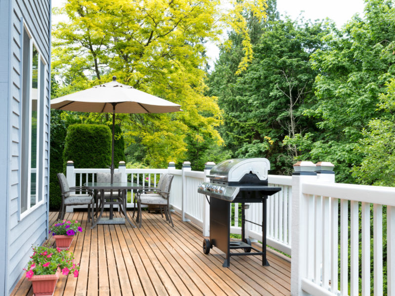 Wood deck with a grill and table
