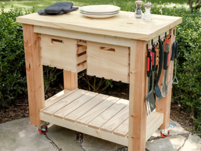 Wood grill cart on a patio