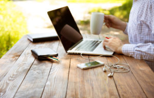 Man working outside on computer