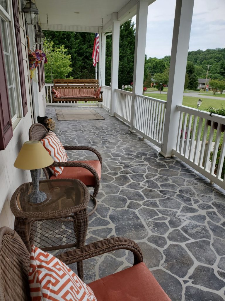 This front porch was finished using SpreadStone™ Decorative Concrete Resurfacing Kit and a Flagstone Stencil Kit from Daich Coatings.