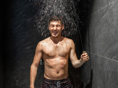Man taking a cold shower