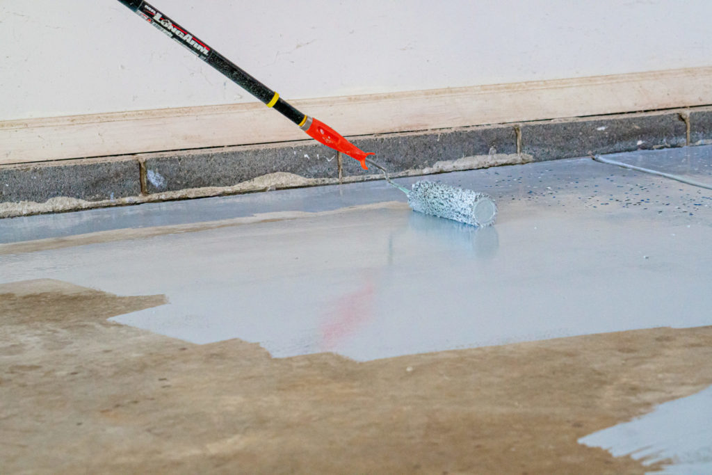 Applying garage floor epoxy coating