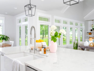 white kitchen with glass doors and tanden windows