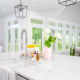 white kitchen with glass doors and tanden windows