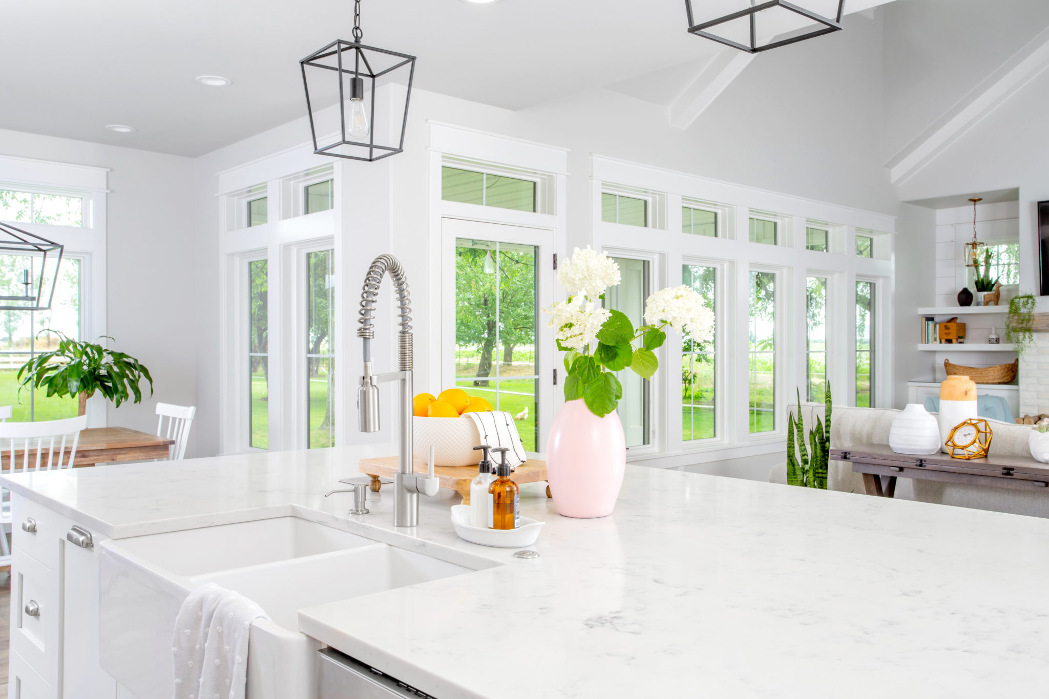 white kitchen with glass doors and tanden windows