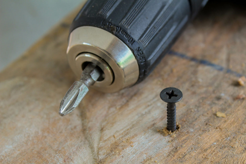 Drywall screw driven in by drill to secure subfloor to floor joists and prevent squeaks.