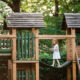 Child on wood play house above ground