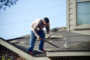 Removing old roof shingles