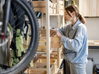 Woman putting things away in an organized garage