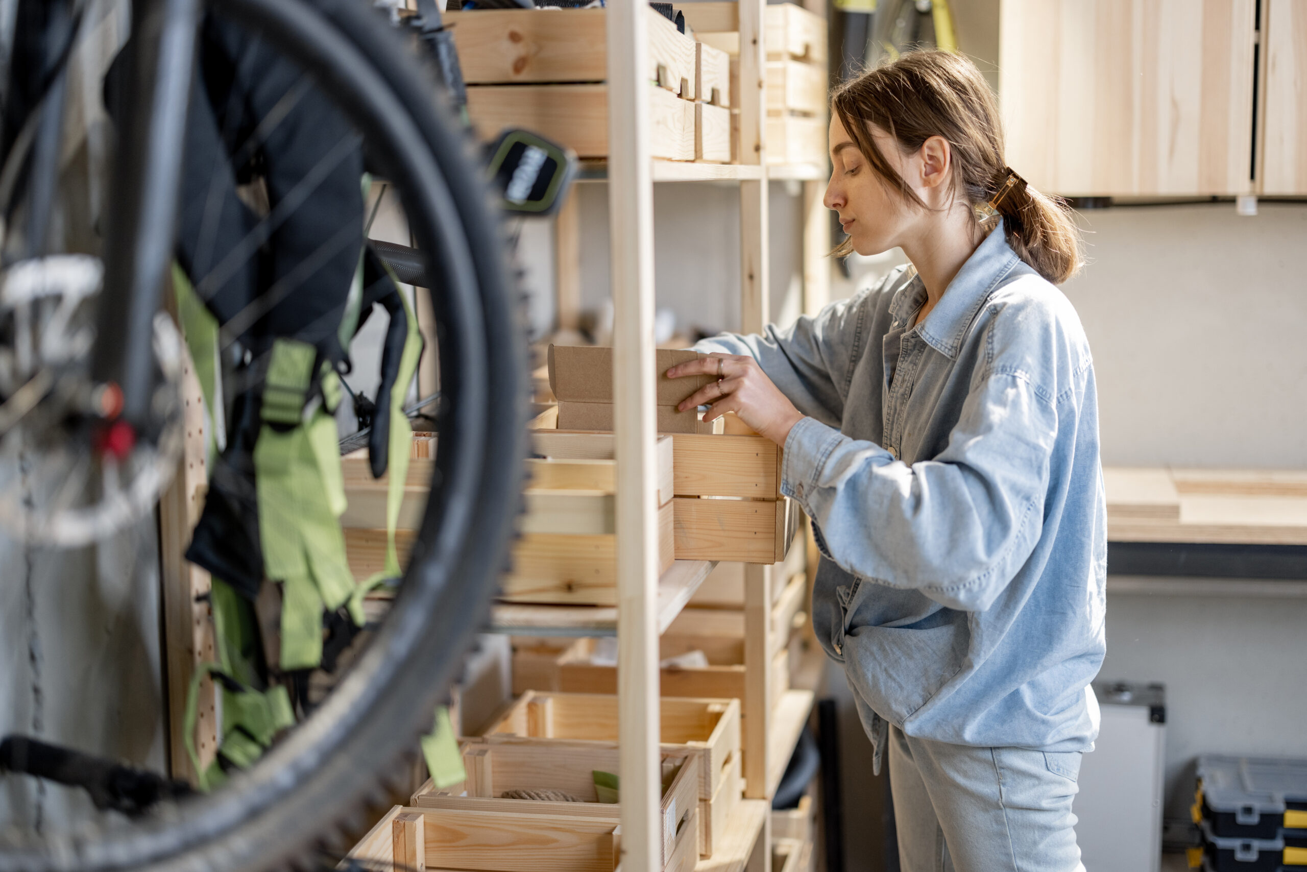 Woman putting things away in an organized garage